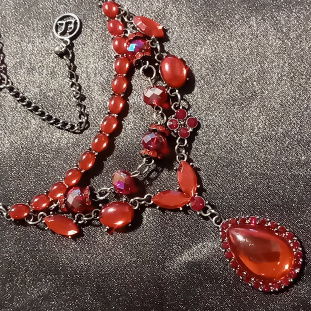 Erica lyons statement necklace red opalescent with a blackened chain.